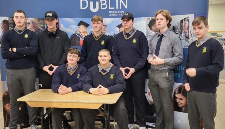 Group of secondary students in front of TU Dublin pull up banner
