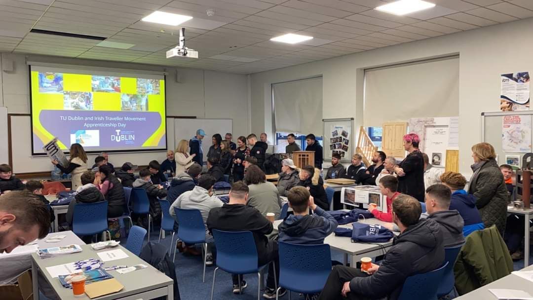A group of students and staff members looking at a presentation on apprenticeships in TU Dublin