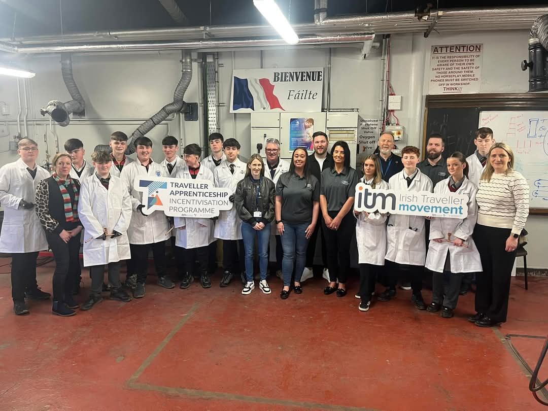 A group of students from Beaufort College, Irish Traveller Movement and TU Dublin staff members posing for a photo in the plumbing workshop during the try a trade day