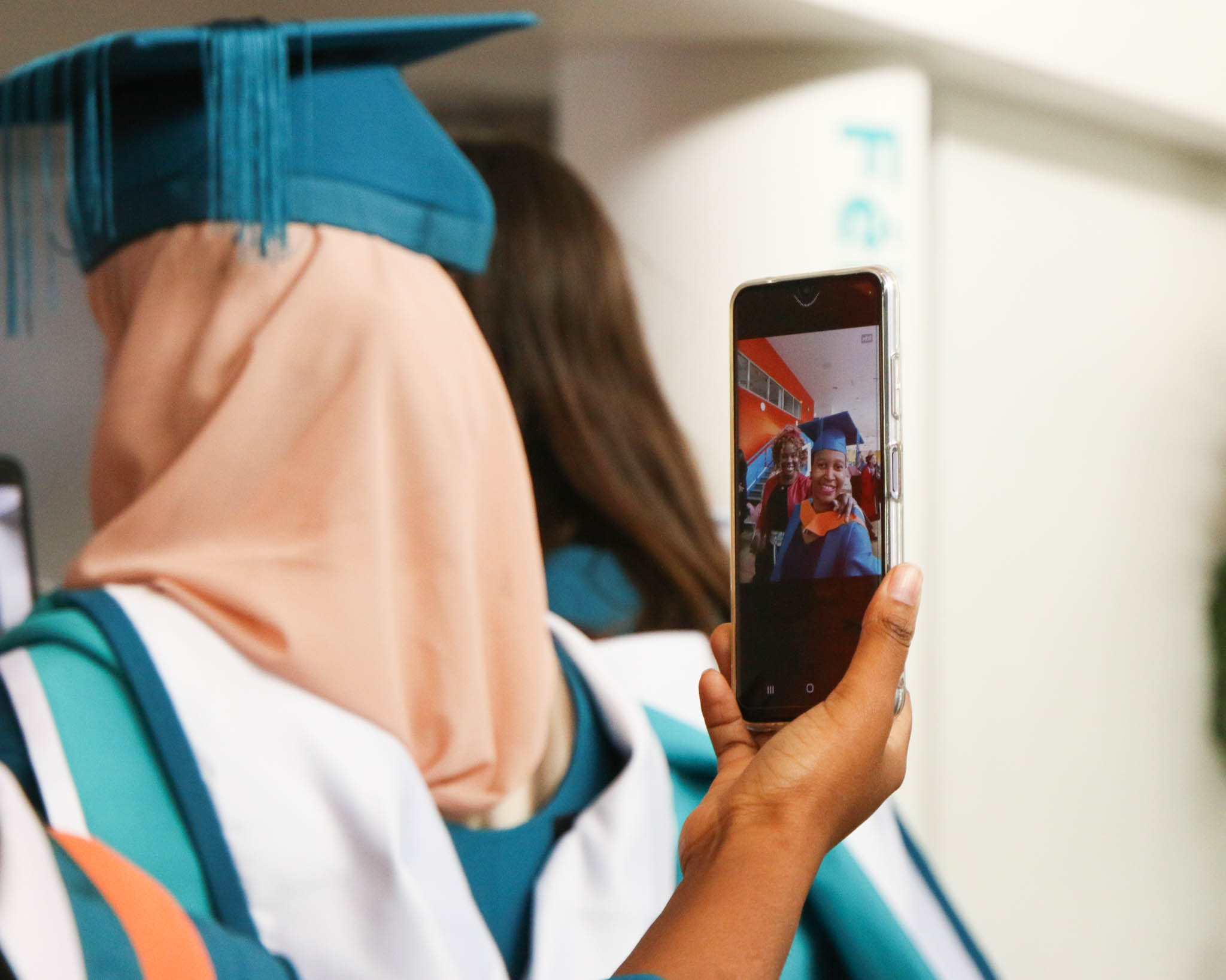 A graduate posing for a photograph