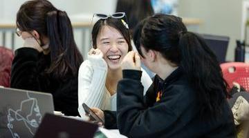 two women laughing