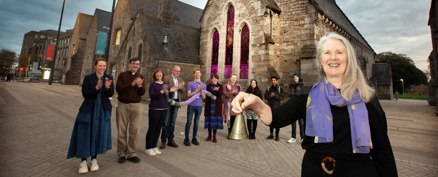 Staff members marking International Day of Persons with Disabilities, lighting St. Lawrence's church