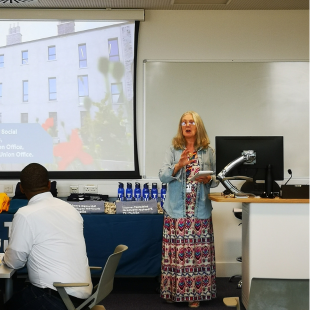 yvonne galligan speaking at the access alumni network event