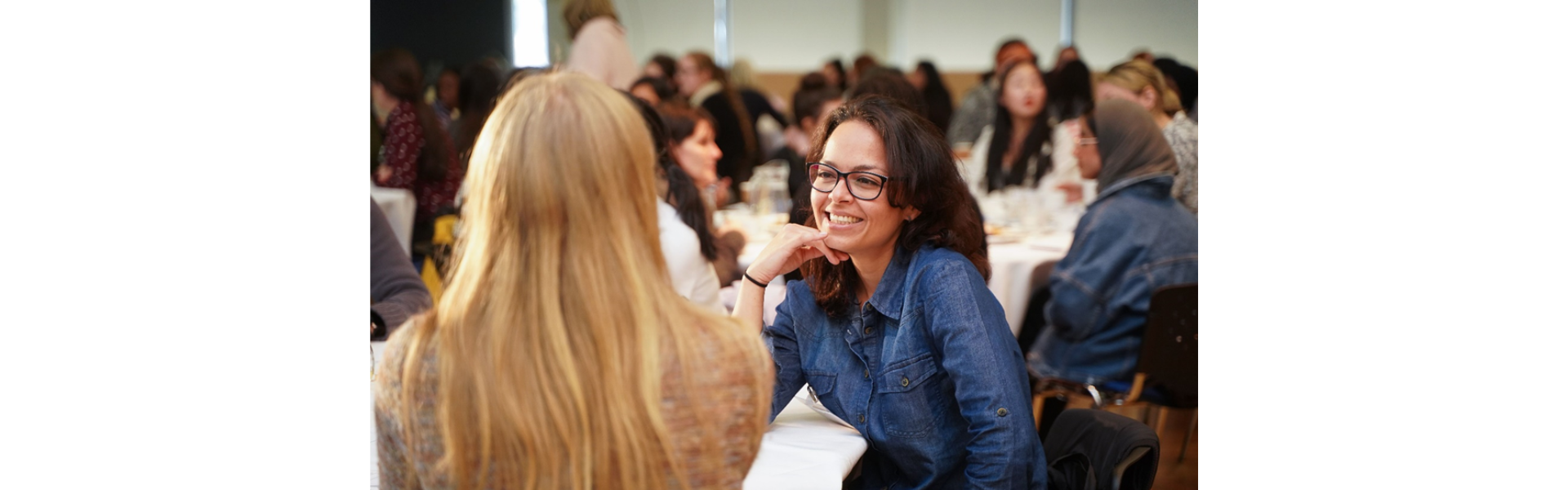 two women chat at an esteem event