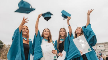 Image for A young women uses a drill on a wooden frame