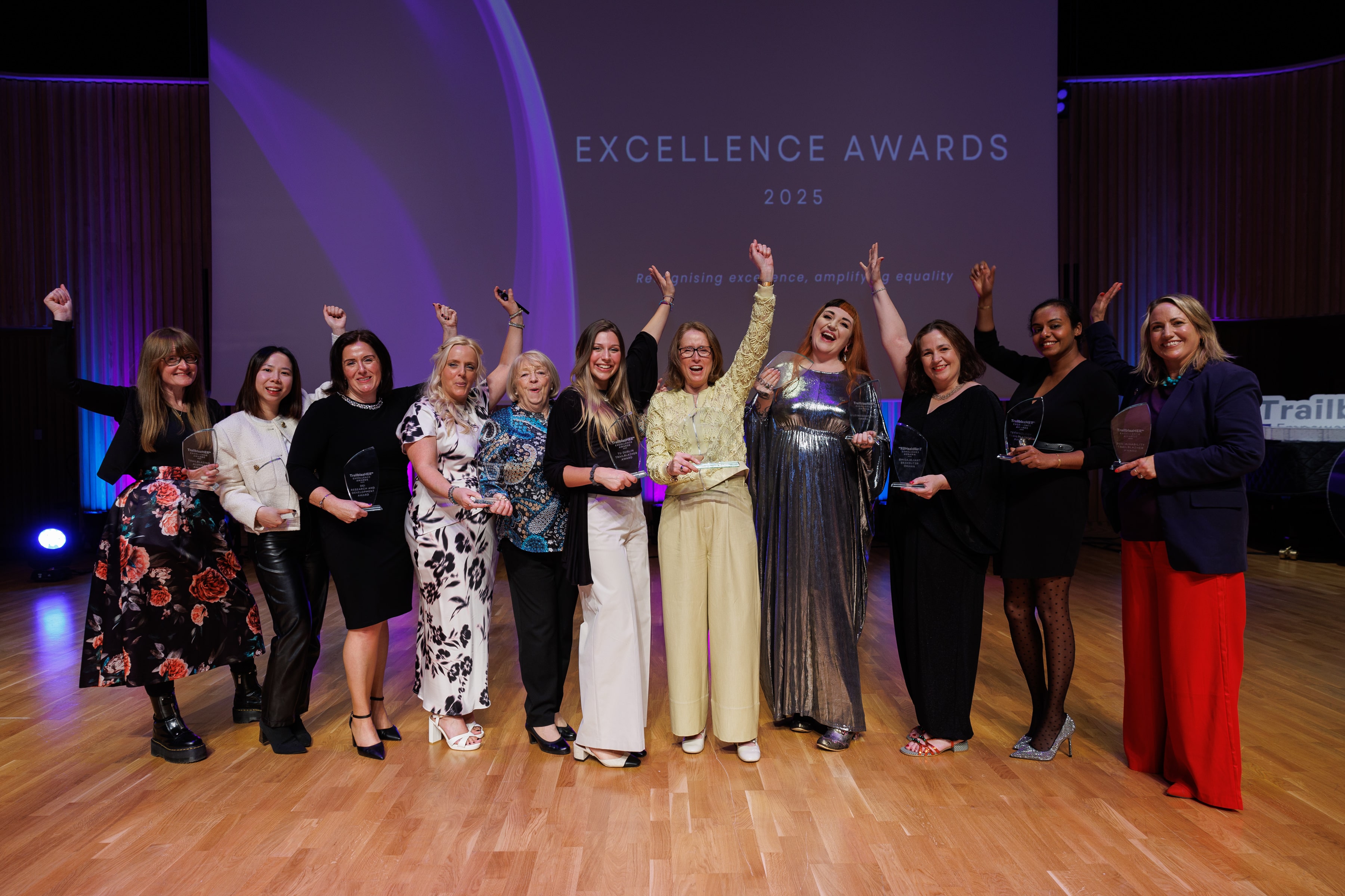 Group of winners holding their trophies