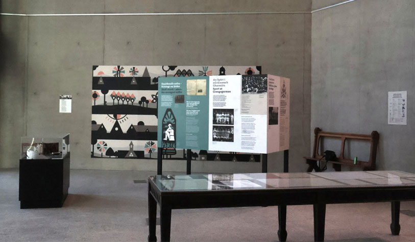 exhibition space with concrete walks and displays