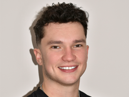 profile photo of smiling young white man with dark hair