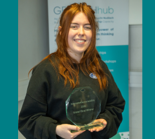 Photo of Innovate4Sustainability competition winner holding trophy