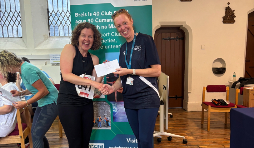 Woman presented with prize by other woman