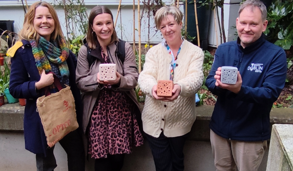 TU Dublin staff holding bee stones