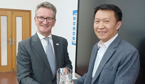 Professor Declan McCormack Head of School of Chemical and BioPharmaceutical Sciences, makes a presentation to Professor Wang Li, Vice Director, Office of International Relations, Nanjing Tech University.