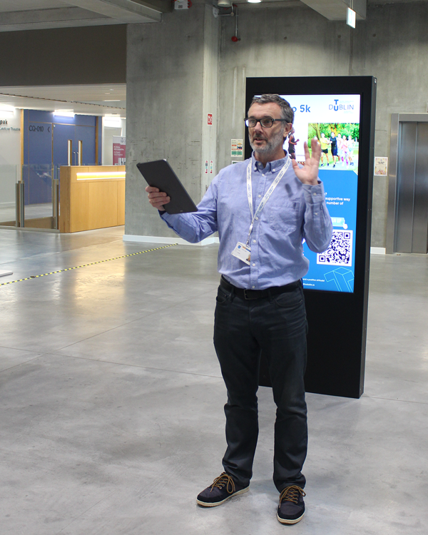 person standing and talking in Large Foyer