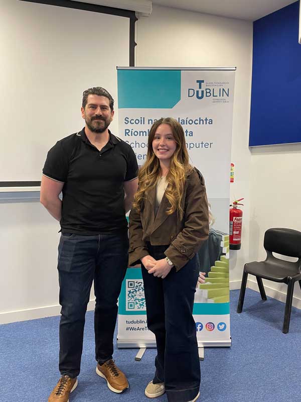 Person receiving prize from another individual