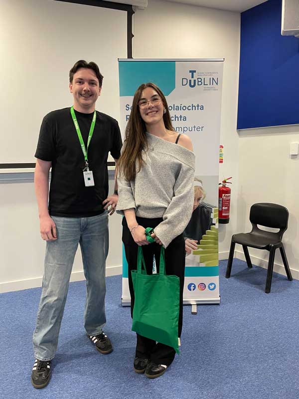 Person receiving prize from another individual