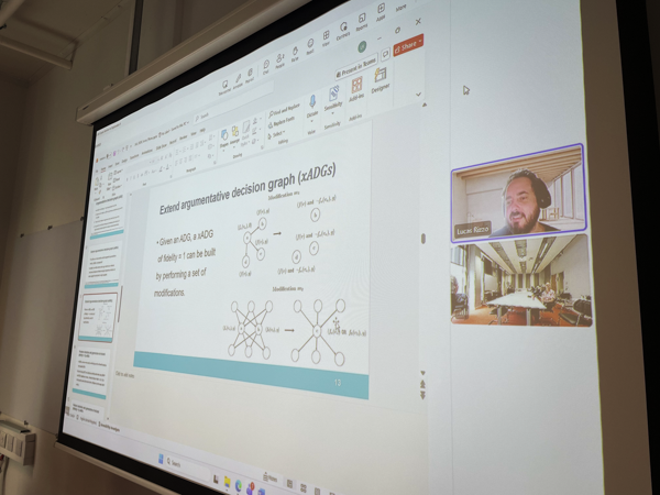person delivering talk from a screen