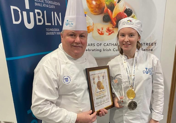 Photo of Alanna Moffitt winner at Chef Olympiad with lecturer George Smith