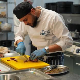 student preparing food