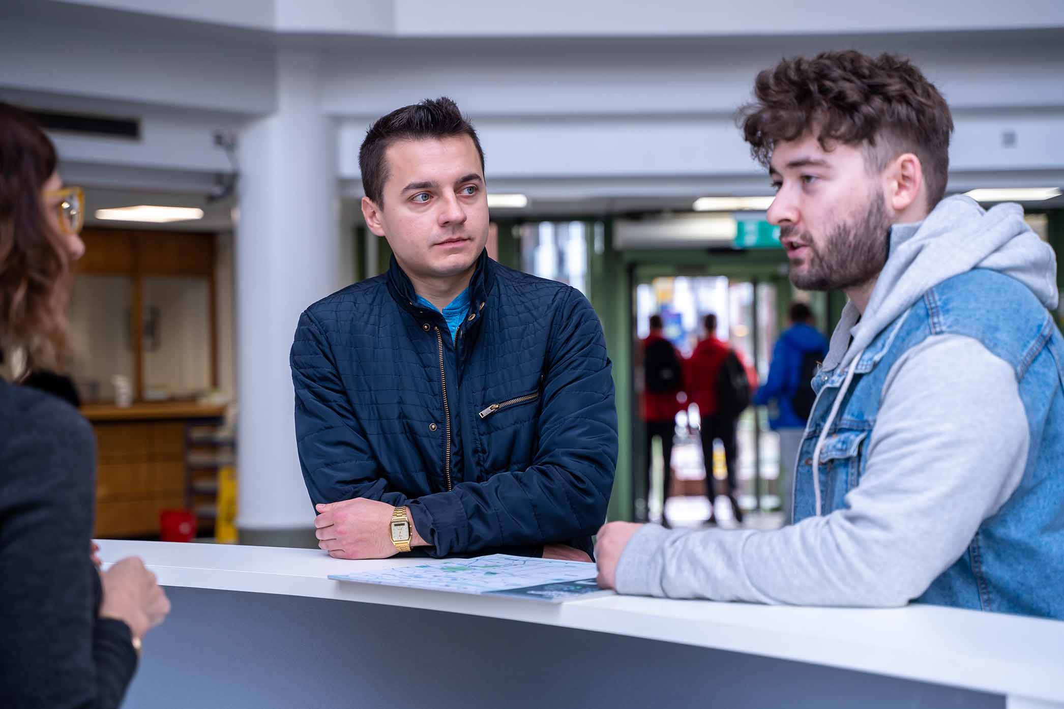 Students getting advice at a help desk