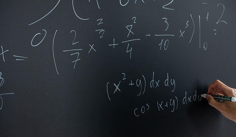 Writing maths formula on blackboard