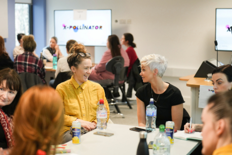 participants talking in small group at event