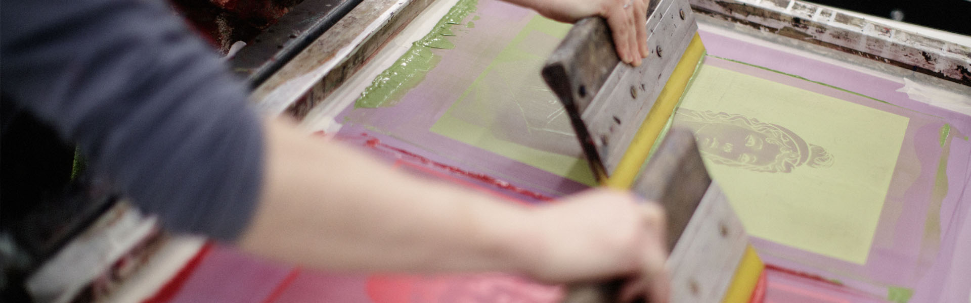 A student creating a piece of print work in class at TUDublin