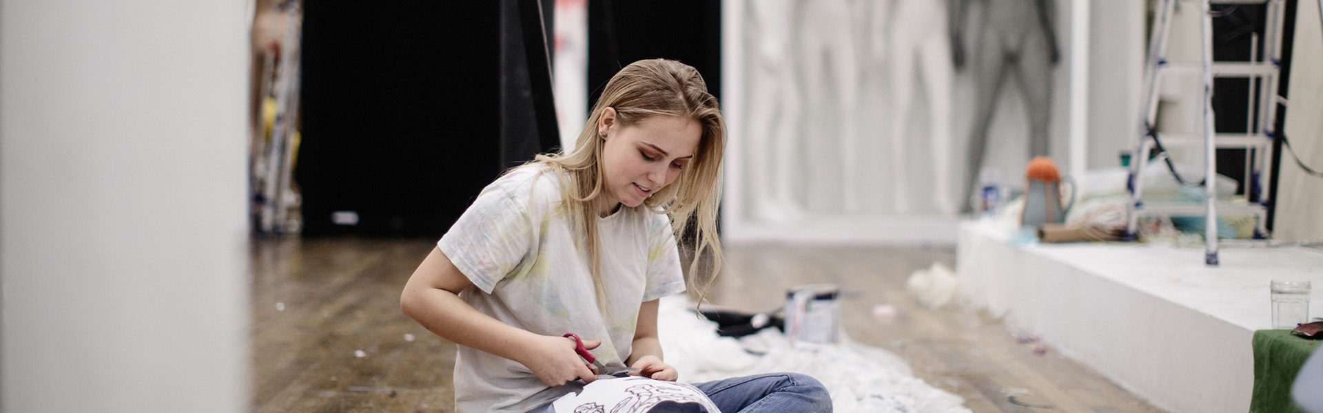 A student cutting material on an art & design course at TUDublin