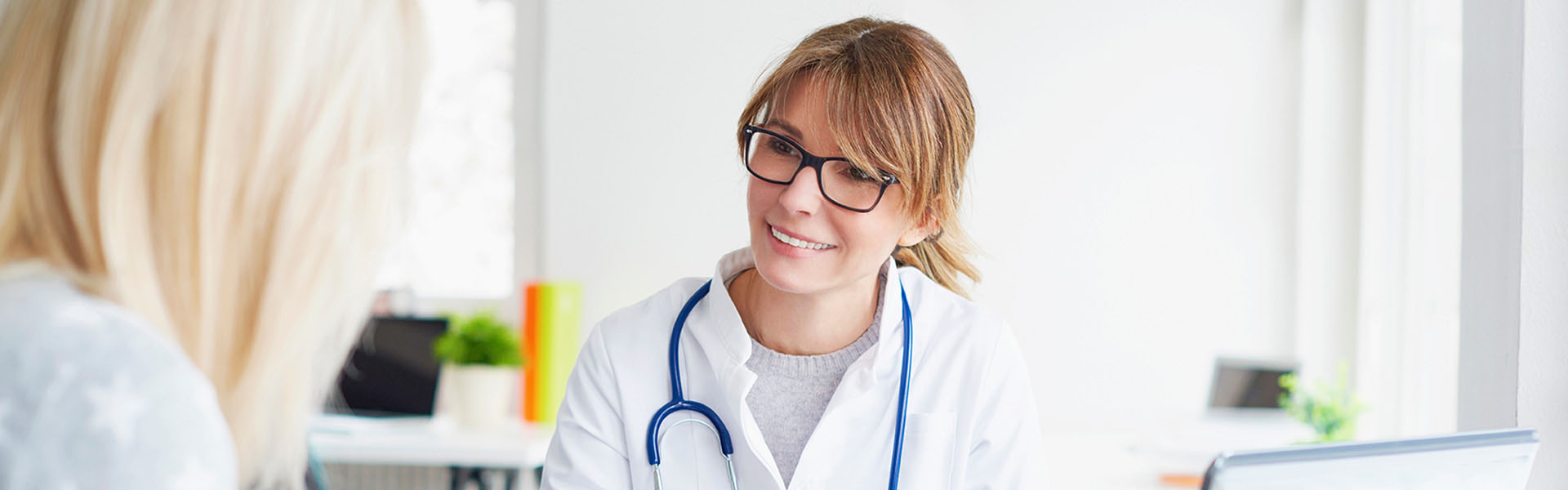 nurse speaking with a women