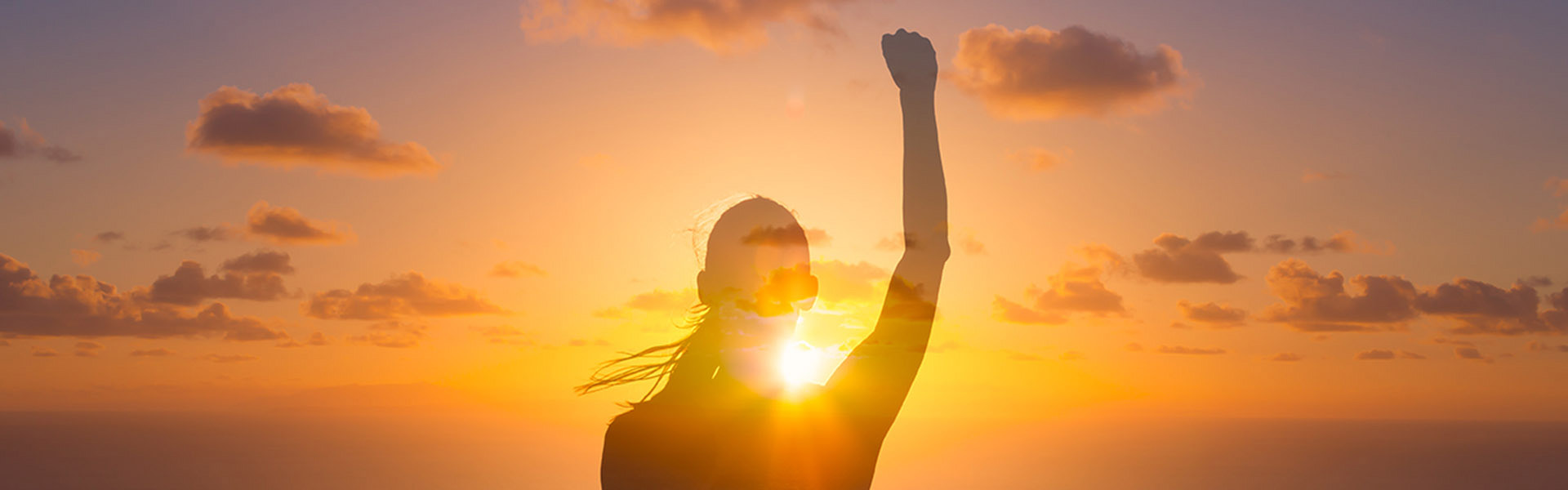 person standing in a sun drenched beach