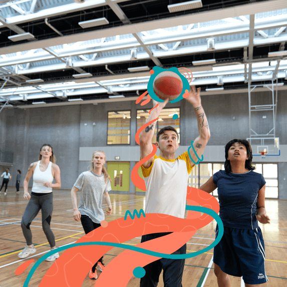 students playing basketball in sports hall