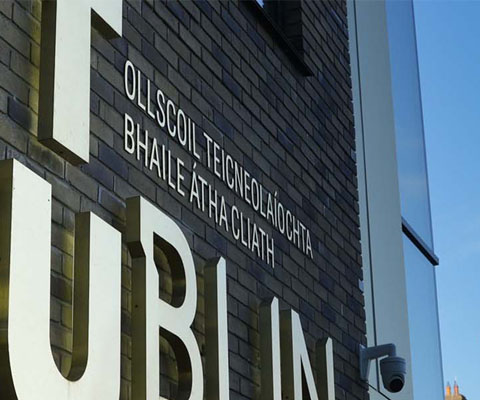 TU Dublin Brass sign east quad building Grangegorman clock tower in background
