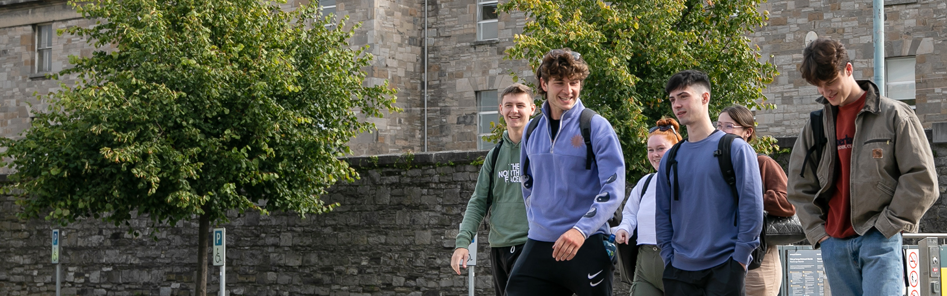 student group laughing outdoors grangegorman