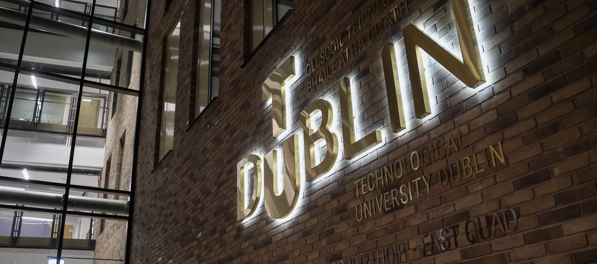 TU Dublin logo brass sign on East Quad building