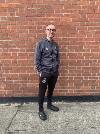 An exhibition photo of a male Shamrock Rovers volunteer