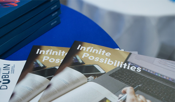 Brochures with the text Infinite Possibilities on the front