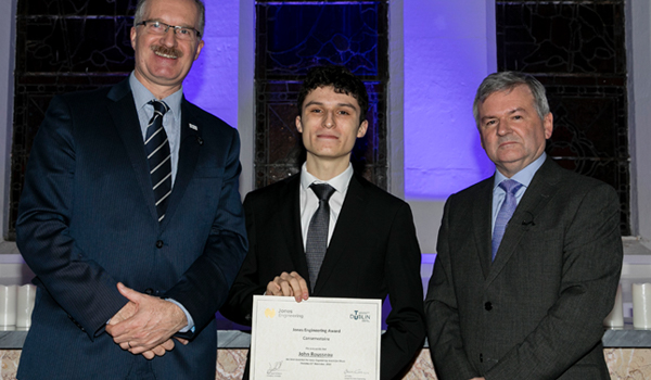 John Rousseau accepting his scholarship