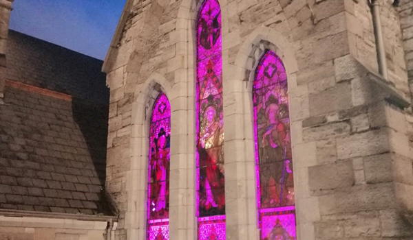 St Laurence building with purple light shining through the windows