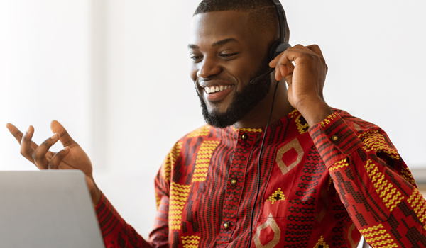 Man Making Video Call With Laptop And Headset