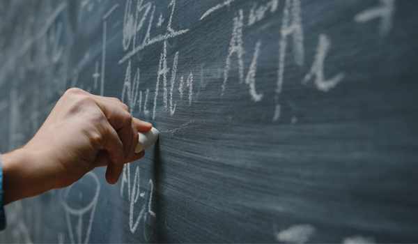 Writing chalk on a blackboard