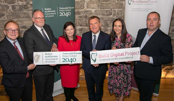 Photo of a group of people holding a Project 2040 sign and Build Digital Sign