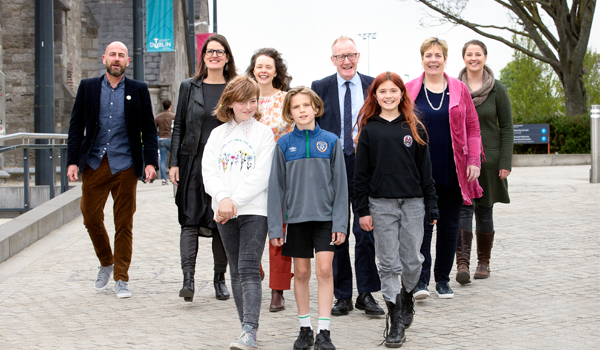 A group of adults and children walking