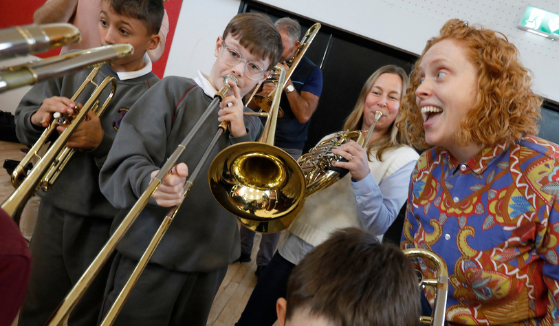 Students play brass instruments