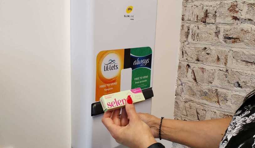 A photo a tampon and sanitary pad dispenser