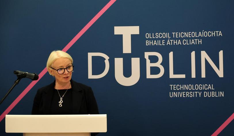 Dr Deirdre Lillis, President of TU Dublin speaking at an event in front of a banner with a TU Dublin logo behind her