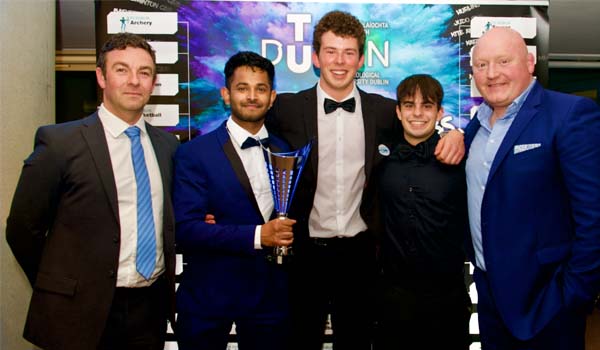 Smiling people with a trophy