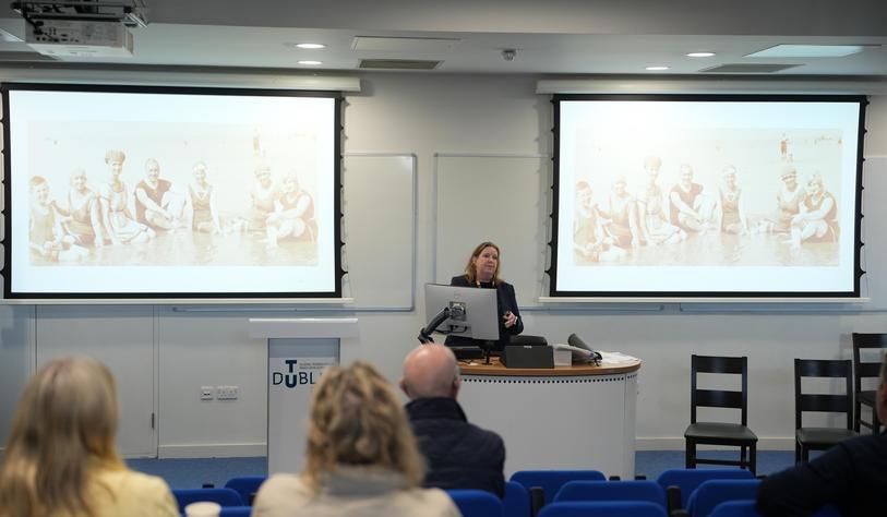 A speaker talking in front of audience