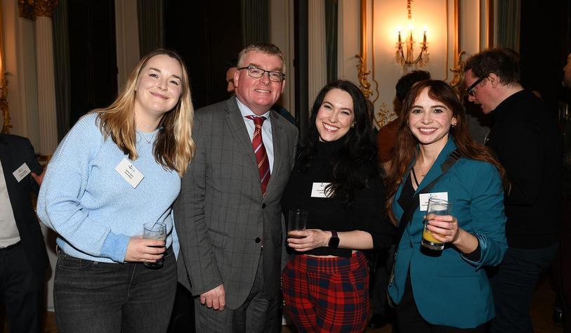 Graduates attend an alumni event in London