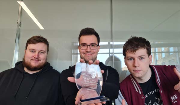 TU Dublin Game Design students hold a Game Fleadh trophy