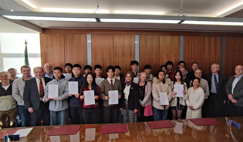 Student and staff celebrating receiving scholarships at an event