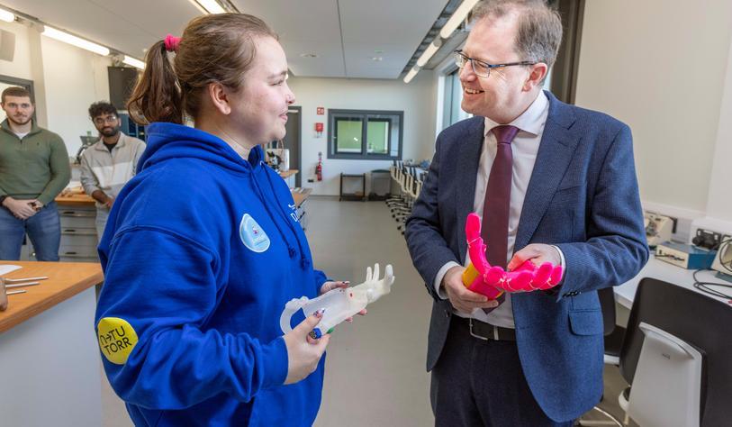 Biomedical Design Student Diana Wielgosz shows Minister James Lawless a prosthetic hand she designed at the opening of the new Áras Thuaidh building in TU Dublin, Tallaght.